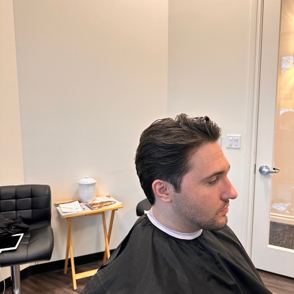 Textured men's scissor cut with soft tapered sides, profile view